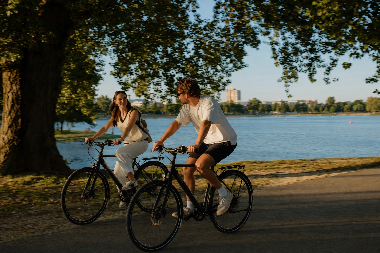 A couple cycling beside Jarun Lake in Zagreb
